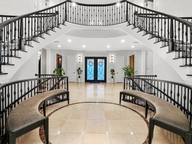 51 Hillburn Ln, North Barrington, IL 60010 - foyer entrance with inlaid floor details, a towering ceiling, stairs, recessed lighting, and french doors