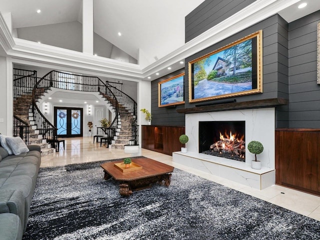 51 Hillburn Ln, North Barrington, IL 60010 - tiled living area featuring high vaulted ceiling, stairs, recessed lighting, a high end fireplace, and wooden walls