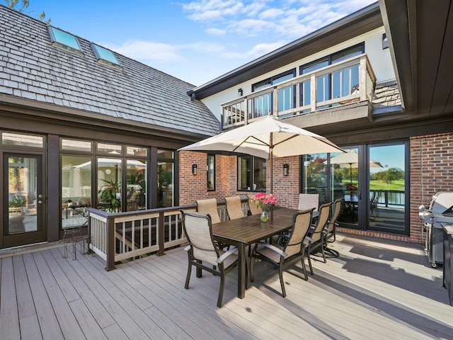 wooden terrace featuring area for grilling