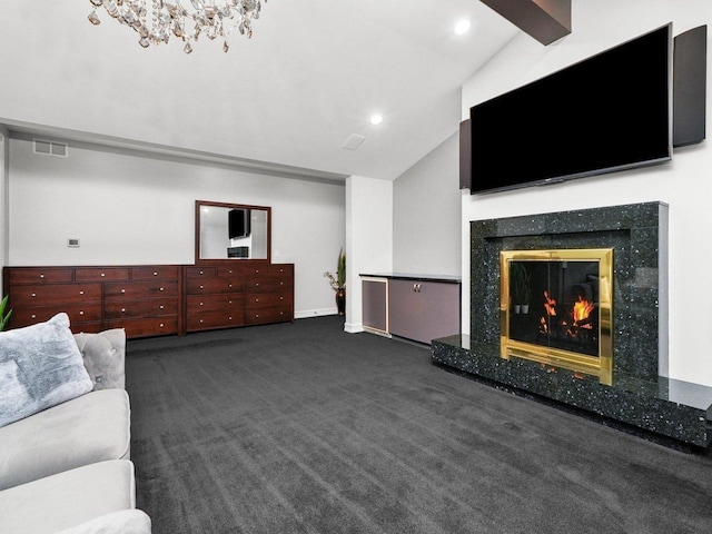 unfurnished living room with vaulted ceiling, a premium fireplace, and dark carpet