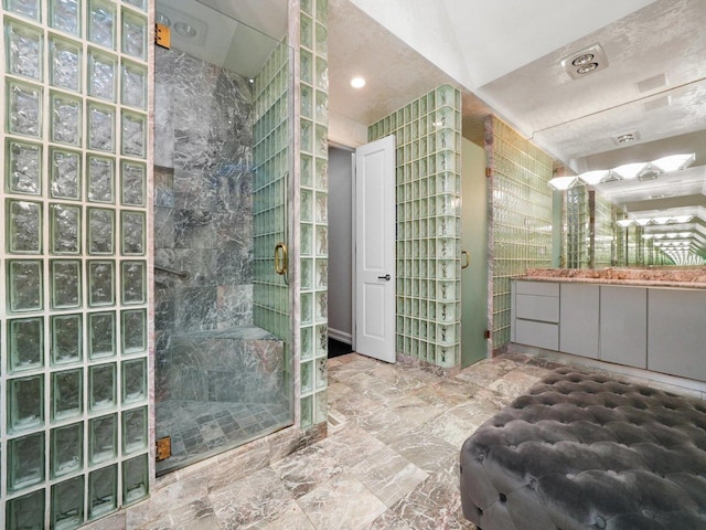 bathroom with vanity and walk in shower