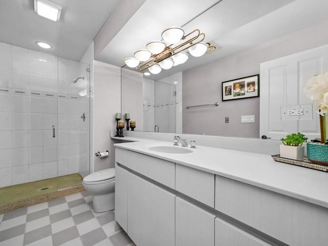 bathroom with vanity, toilet, and walk in shower