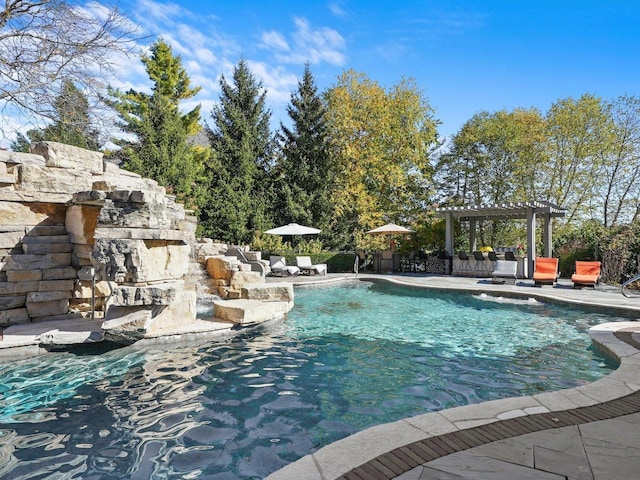 view of pool with a pergola and a patio