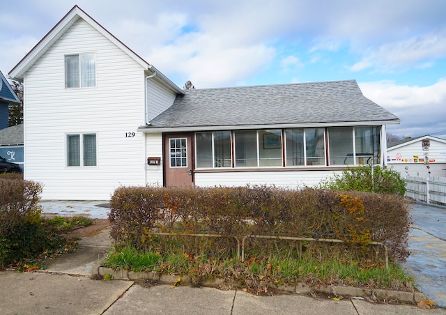 view of front facade with a sunroom