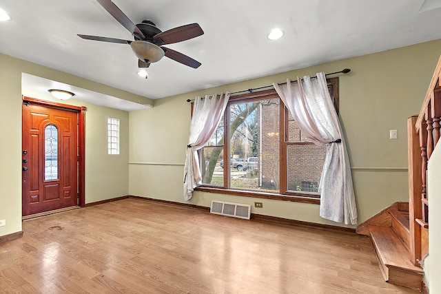 entryway with light hardwood / wood-style floors and ceiling fan