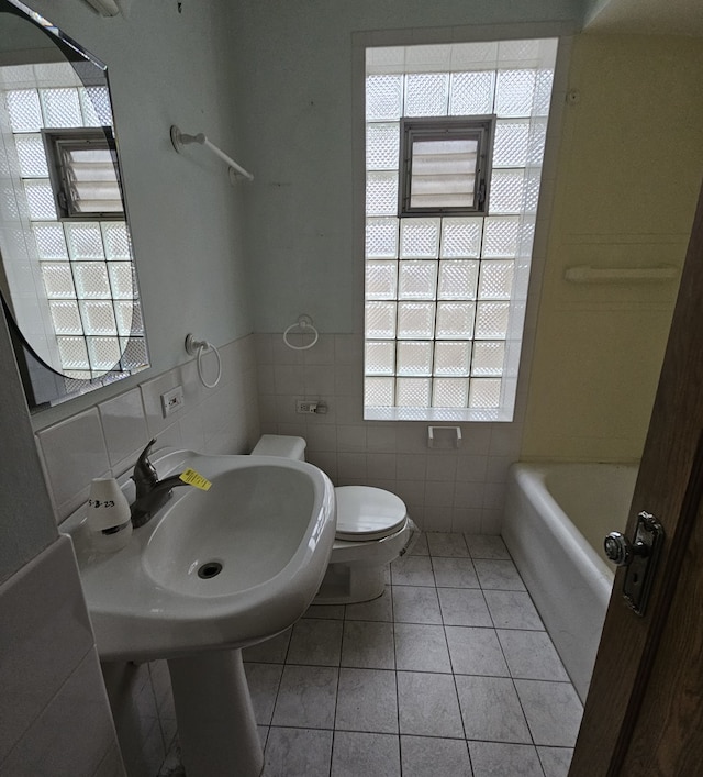 bathroom featuring tile patterned flooring, vanity, and toilet