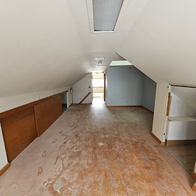 garage with wood walls and a garage door opener