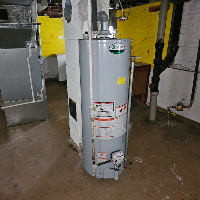 utility room featuring heating unit and water heater