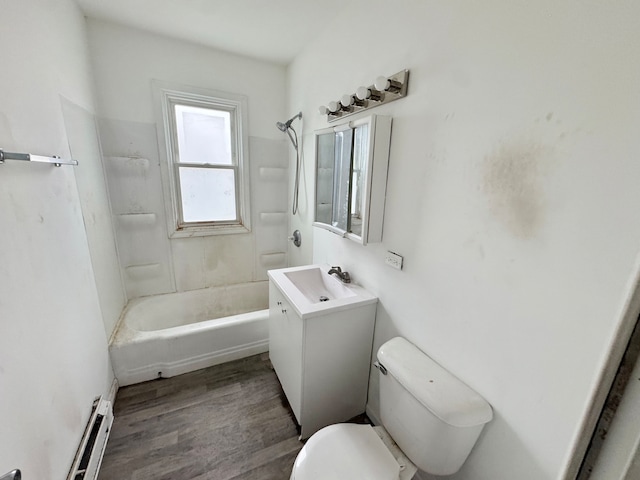 full bathroom featuring shower / bathing tub combination, vanity, a baseboard heating unit, toilet, and wood-type flooring