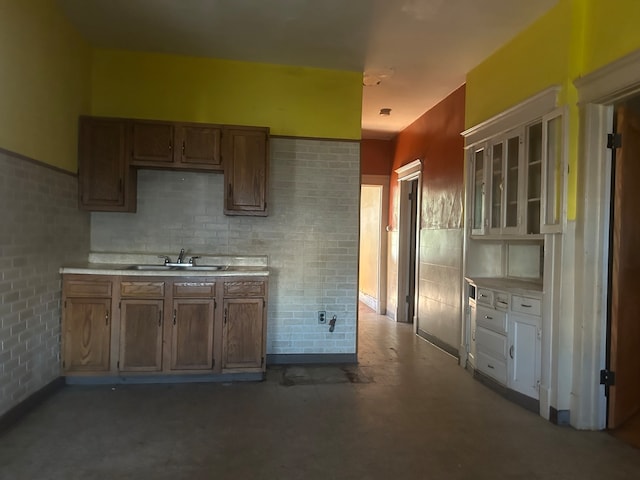 kitchen featuring concrete floors and sink