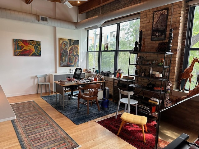 office space with wood-type flooring