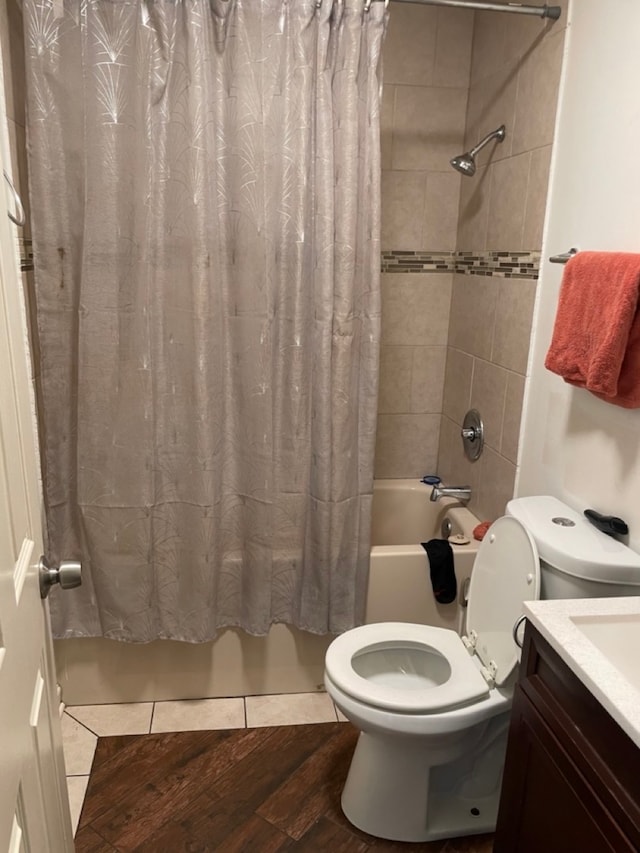 full bathroom featuring shower / bathtub combination with curtain, vanity, toilet, and wood-type flooring