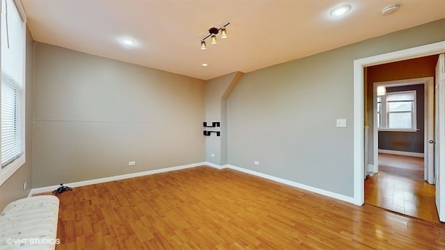 unfurnished room with light hardwood / wood-style flooring