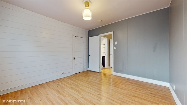 spare room with light hardwood / wood-style floors