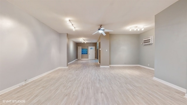 interior space featuring ceiling fan, light wood-type flooring, and rail lighting