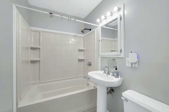 bathroom featuring toilet and shower / bath combination