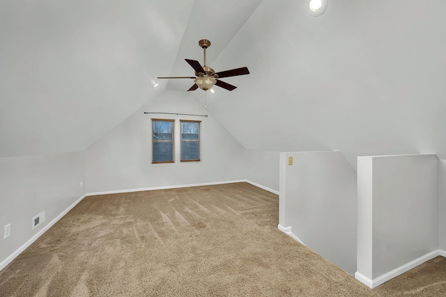 additional living space featuring carpet, vaulted ceiling, and ceiling fan