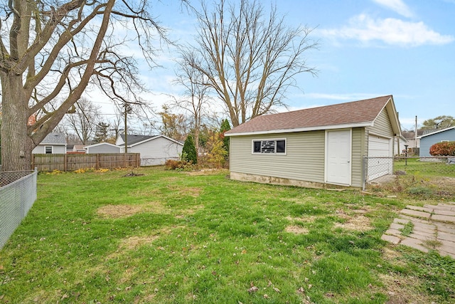 view of yard with an outbuilding and a garage