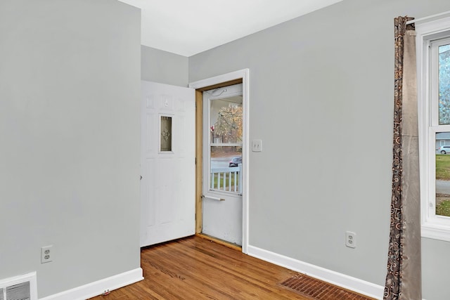 unfurnished room featuring hardwood / wood-style flooring