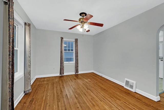 unfurnished room with hardwood / wood-style flooring and ceiling fan