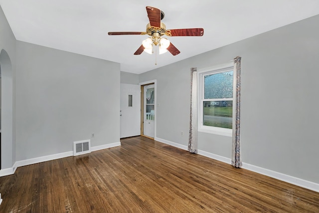 empty room featuring wood-type flooring and ceiling fan