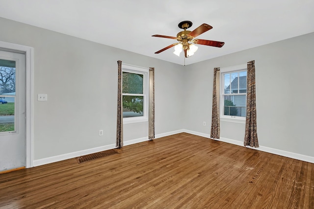 unfurnished room with ceiling fan and wood-type flooring