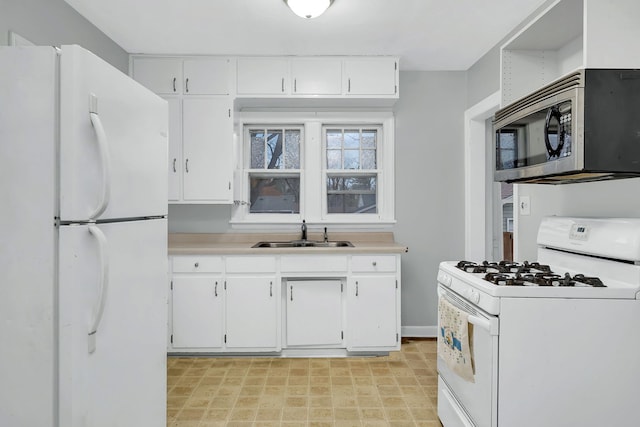 kitchen featuring white cabinets, white appliances, and sink