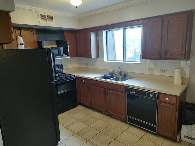 129 W Brandon Ct Unit 33, Palatine, IL 60067 - kitchen with black appliances, backsplash, crown molding, light tile patterned flooring, and light countertops