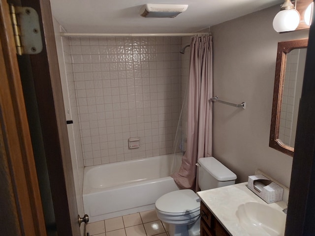 full bathroom featuring tile patterned flooring, vanity, shower / tub combo with curtain, and toilet