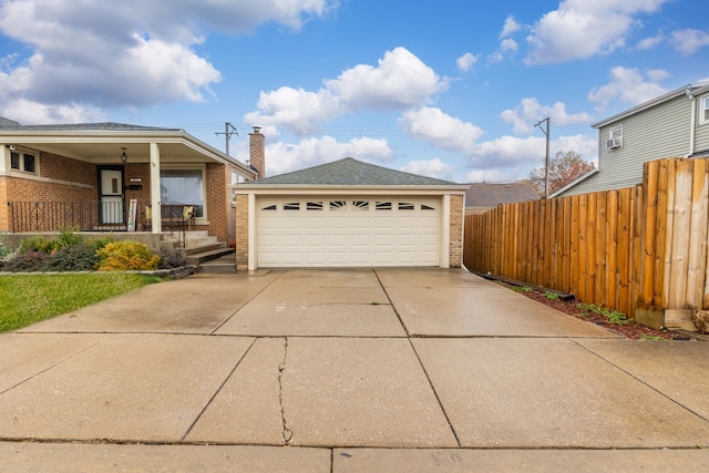 view of front of property featuring a porch and a garage