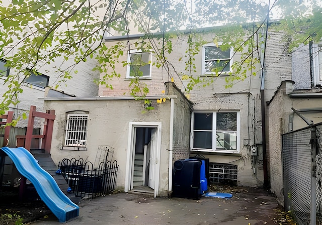 back of house with a patio