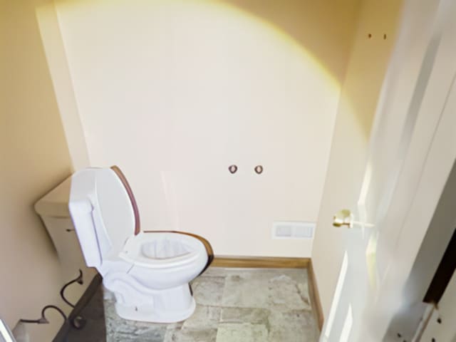 bathroom featuring toilet