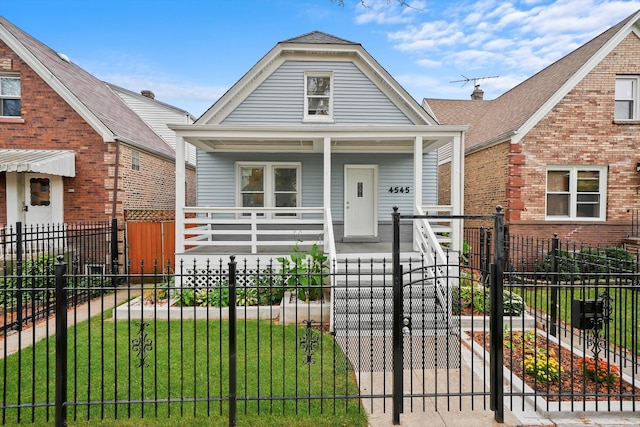 bungalow featuring a front lawn and a porch