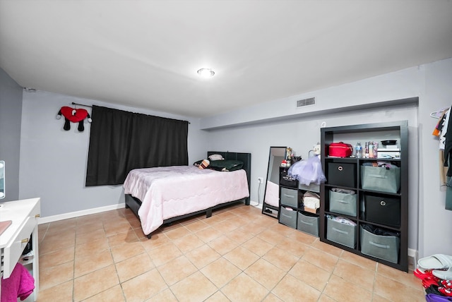 bedroom featuring light tile patterned floors