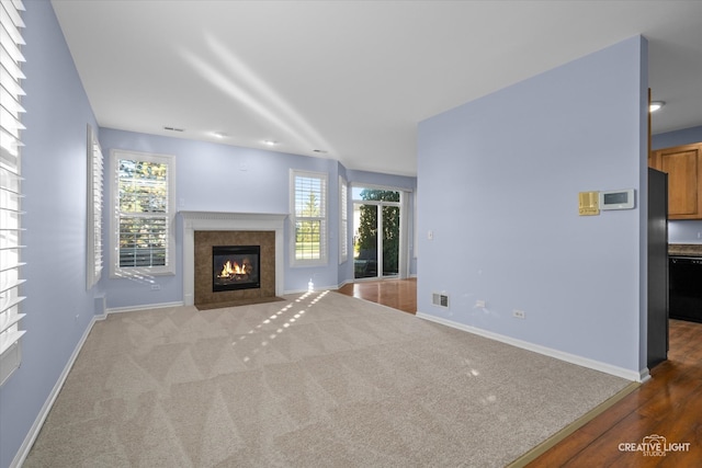 unfurnished living room with light hardwood / wood-style flooring