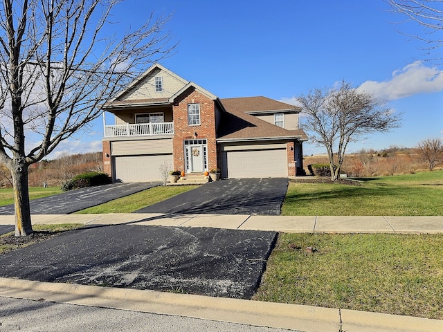 view of front of house featuring a garage and a front lawn