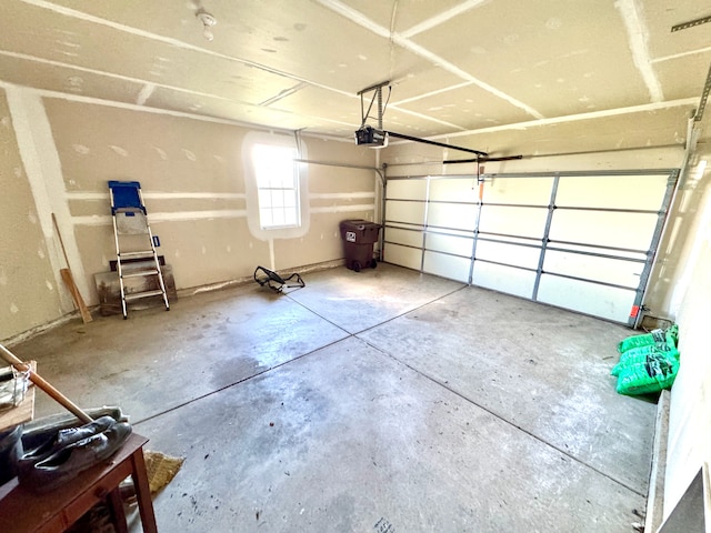 garage featuring a garage door opener