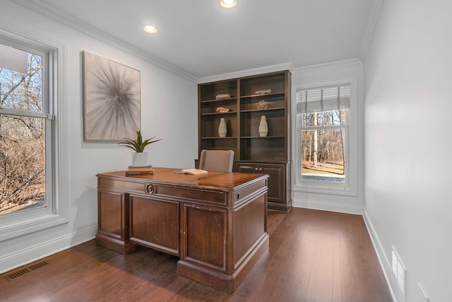 home office with ornamental molding and dark hardwood / wood-style floors