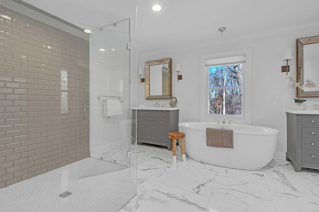 bathroom featuring crown molding, vanity, and shower with separate bathtub