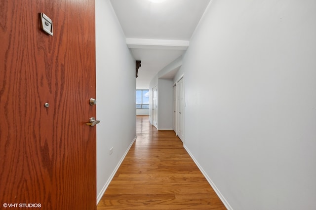 hallway with light hardwood / wood-style flooring