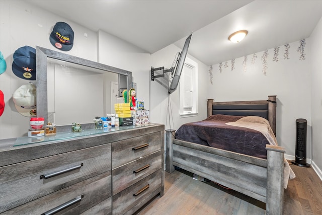 bedroom featuring wood-type flooring