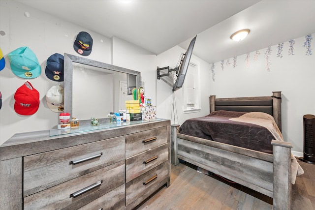 bedroom with light hardwood / wood-style flooring