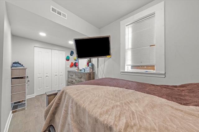 bedroom featuring hardwood / wood-style flooring and a closet