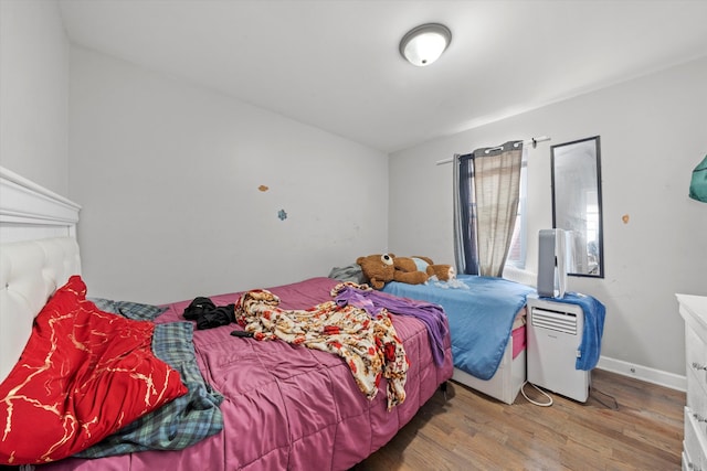 bedroom featuring hardwood / wood-style floors