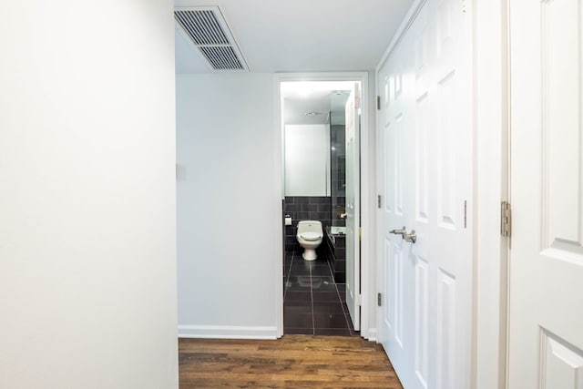 hallway featuring dark hardwood / wood-style floors