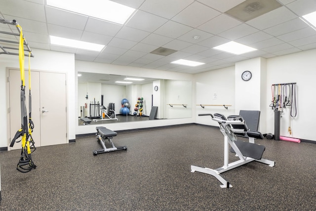 gym featuring a drop ceiling