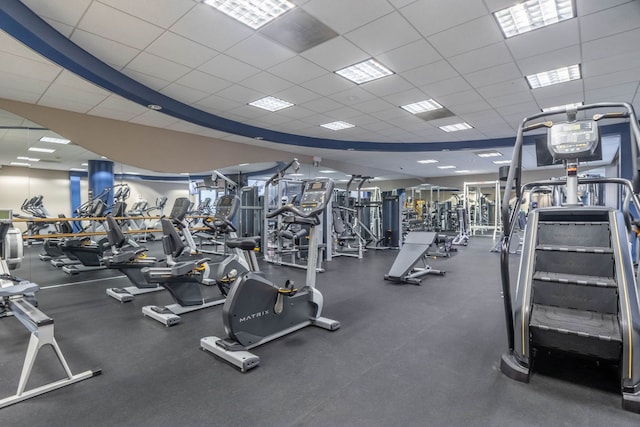 workout area featuring a drop ceiling