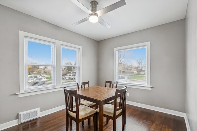 dining room featuring plenty of natural light, dark hardwood / wood-style floors, and ceiling fan