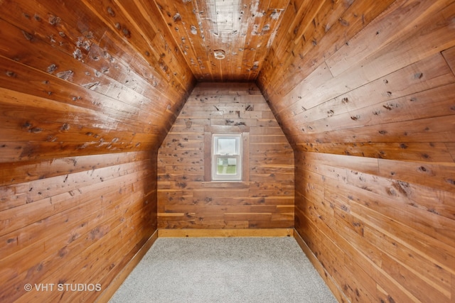 additional living space with carpet flooring, lofted ceiling, wooden walls, and wood ceiling