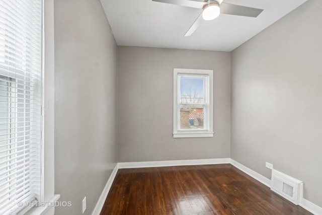 empty room featuring dark hardwood / wood-style floors and ceiling fan